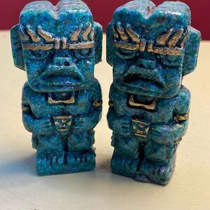 Vintage Warrior statues ground turquoise gold colored trim .